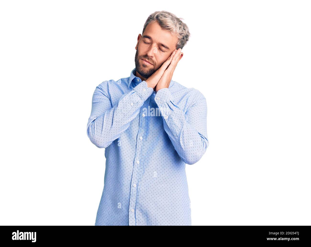 Young handsome blond man wearing elegant shirt sleeping tired dreaming ...