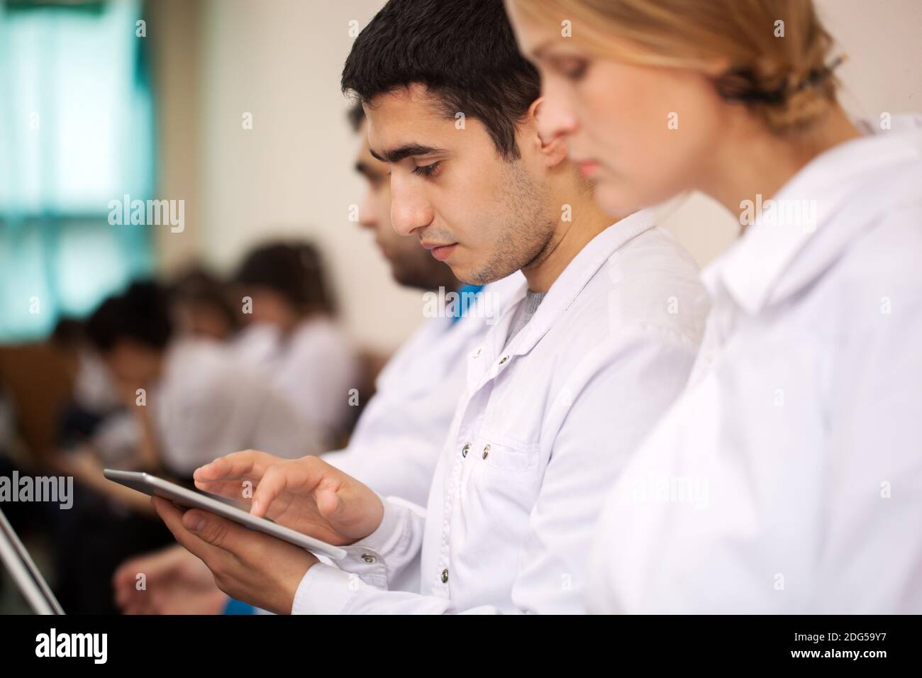 Medical student working with pad on the conference Stock Photo