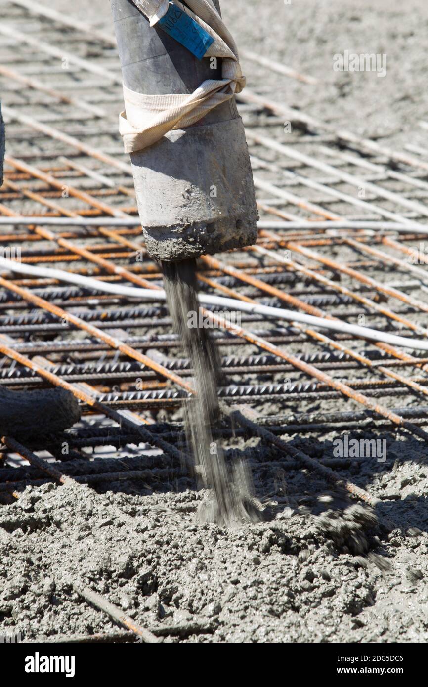 pipe with cement filling the foundation slab of a building under