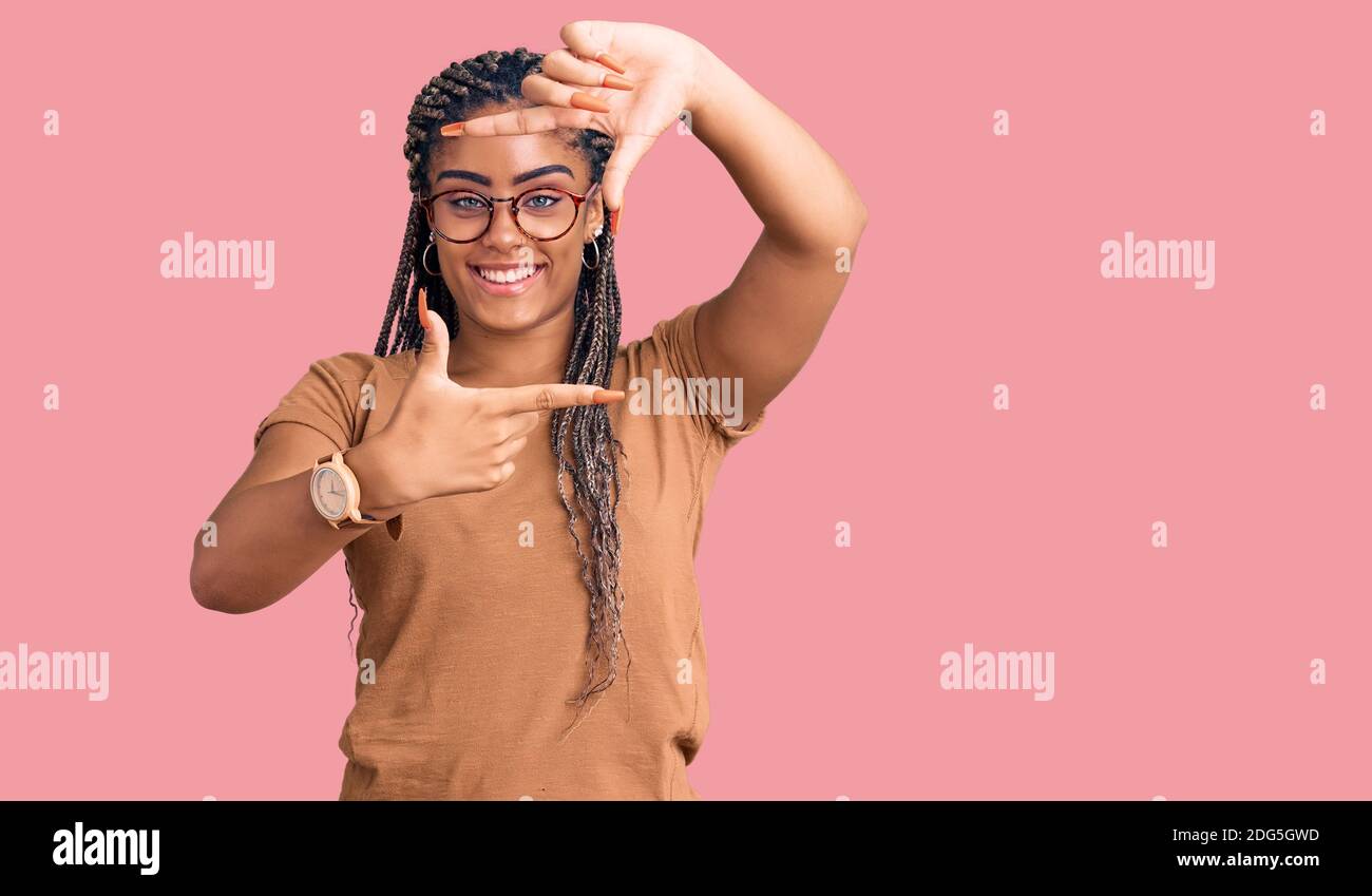 Young african american woman with braids wearing casual clothes and ...