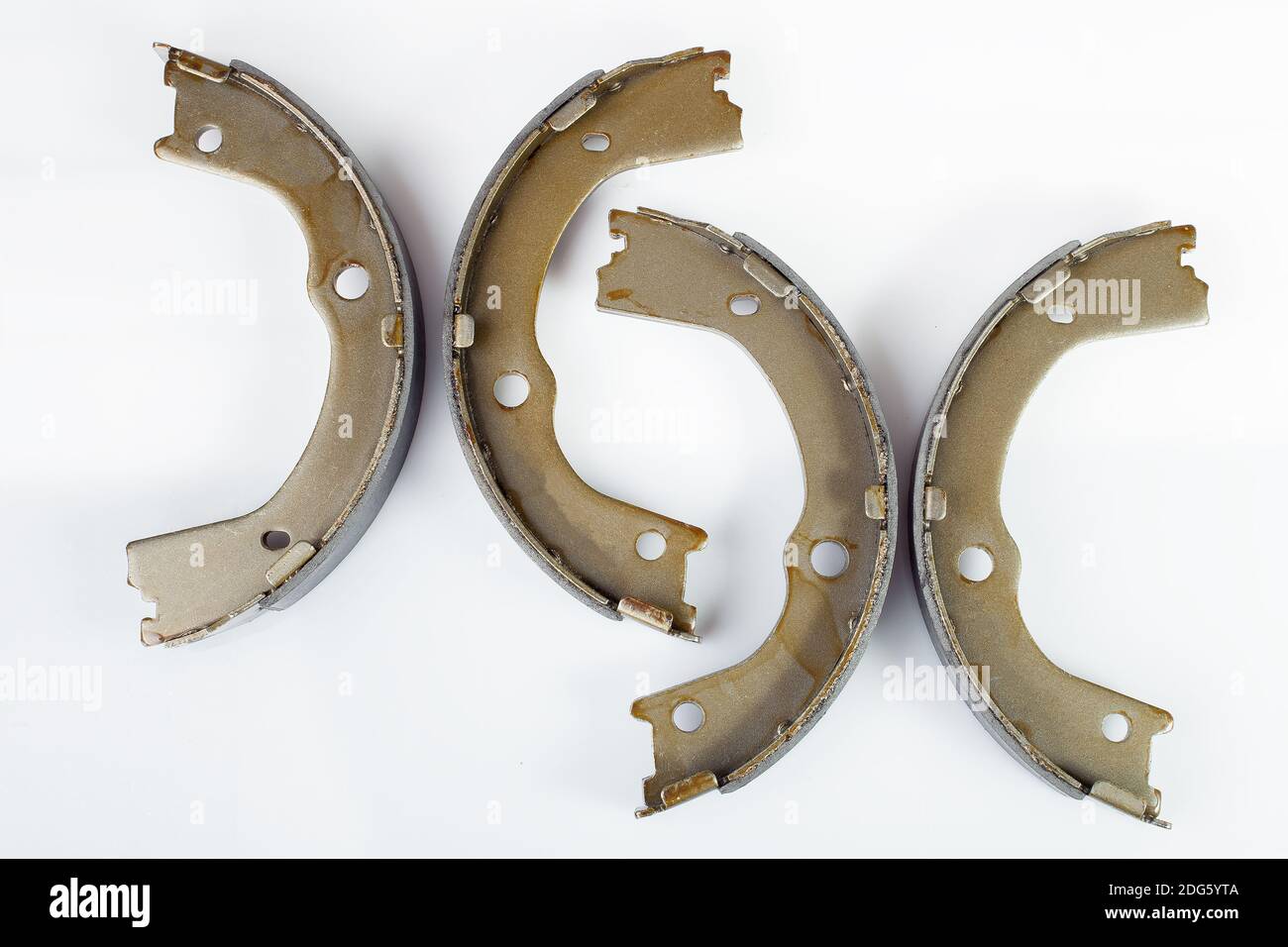 kit of drum brake pads with asbestos alloy on steel car spare parts isolated on white background