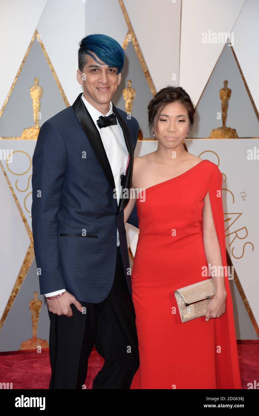 Visual effects artist Mohen Leo (L) and guest attending the 89th Annual Academy Awards at Hollywood & Highland Center on February 26, 2017 in Los Angeles, CA, USA. Stock Photo