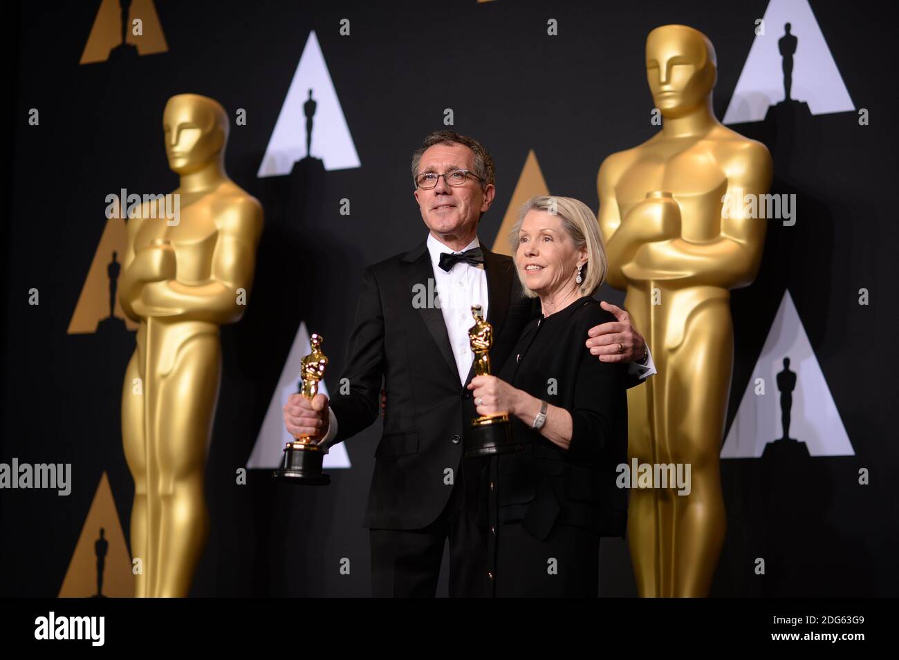 L-R) Production designer David Wasco and art director Sandy Reynolds-Wasco,  winners of the Best Production Design award for 'La La Land,' pose in the  press room during the 89th Annual Academy Awards