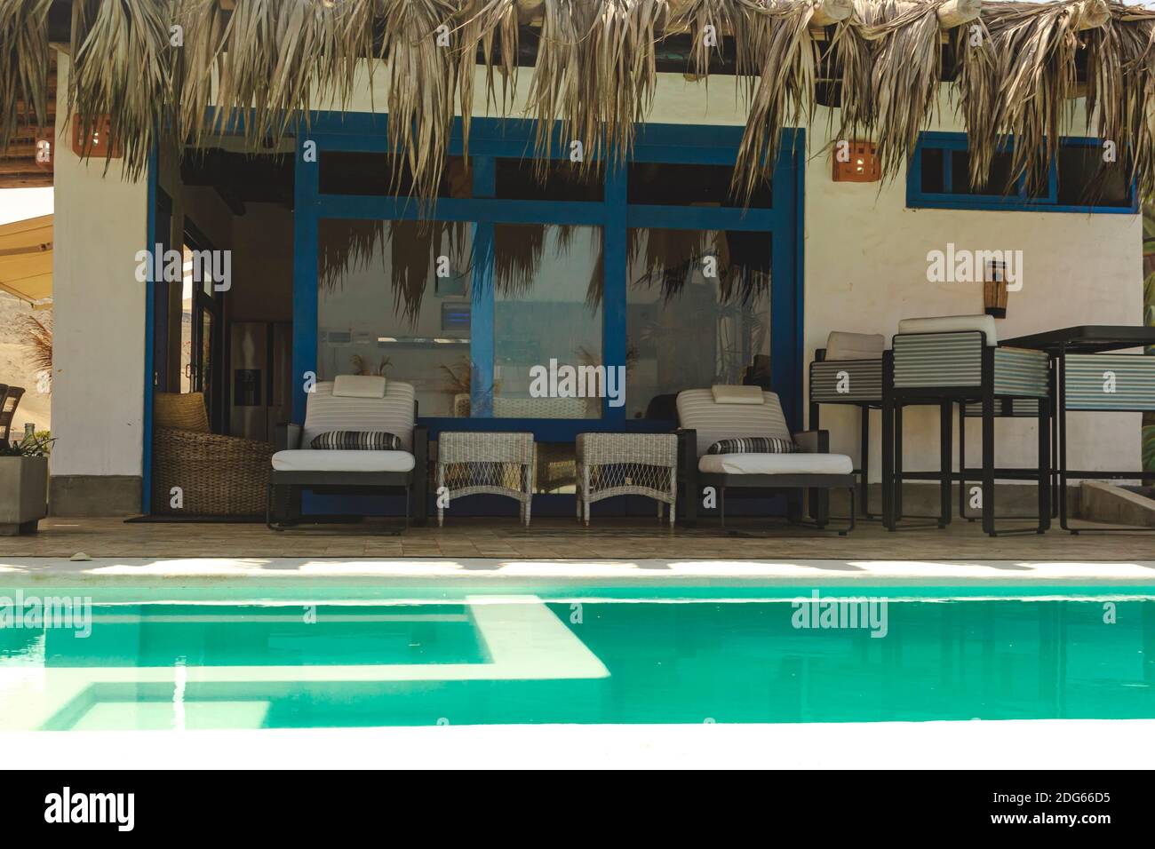 Relaxing summer house on the beach with pool Stock Photo - Alamy