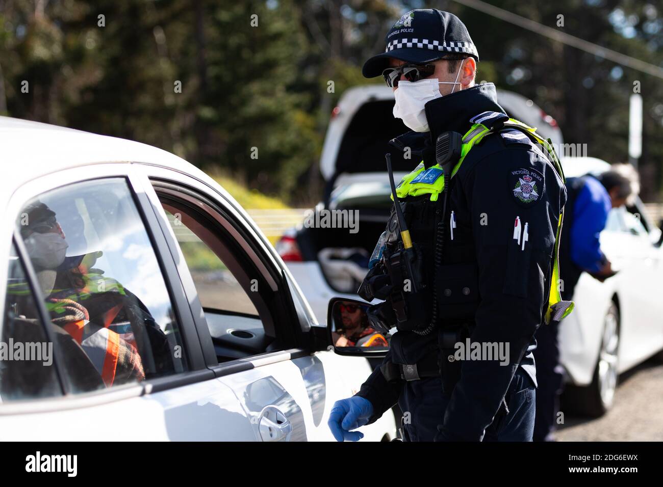 Australia, 9 July, 2020. MELBOURNE, AUSTRALIA - JULY 9: Police are seen  checking drivers licences at a roadblock south of Gisborne as Melbourne  plunges back into Stage 3 lockdowns during COVID