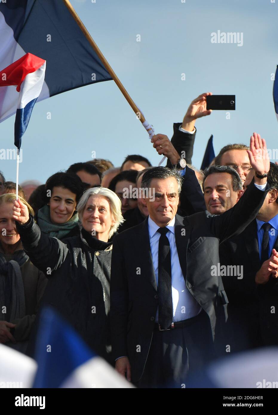 Presidential election candidate for the right-wing Les Republicains (LR) party Francois Fillon and wife Penelope Fillon gesture during a rally at the Place du Trocadero, in Paris, France, on March 5, 2017. Embattled French conservative Francois Fillon told supporters to never give up the fight as he strivses to stay in the presidential election race amid an expenses scandal. Fillon, who is to be charged over claims he gave his wife and children highly-paid fake parliamentary jobs, told the rain-drenched crowd he had been attacked by everyone in the campaign. Photo by Christian Liewig/ABACAPRES Stock Photo