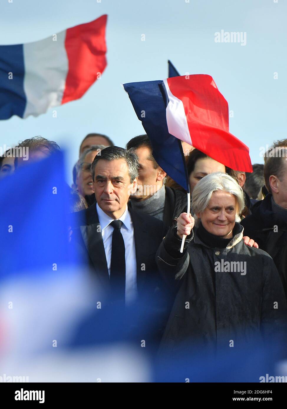 Presidential election candidate for the right-wing Les Republicains (LR) party Francois Fillon and wife Penelope Fillon gesture during a rally at the Place du Trocadero, in Paris, France, on March 5, 2017. Embattled French conservative Francois Fillon told supporters to never give up the fight as he strivses to stay in the presidential election race amid an expenses scandal. Fillon, who is to be charged over claims he gave his wife and children highly-paid fake parliamentary jobs, told the rain-drenched crowd he had been attacked by everyone in the campaign. Photo by Christian Liewig/ABACAPRES Stock Photo