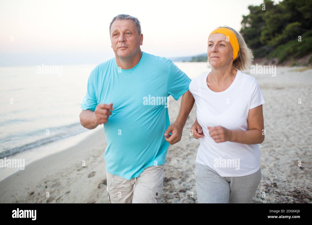 Woman jogging on beach fit hi-res stock photography and images - Alamy