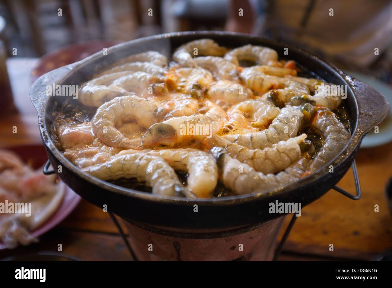 Thai buffet with shrimp cooked on barbecue pan. Thai Barbecue or (Moo Kratha) Stock Photo