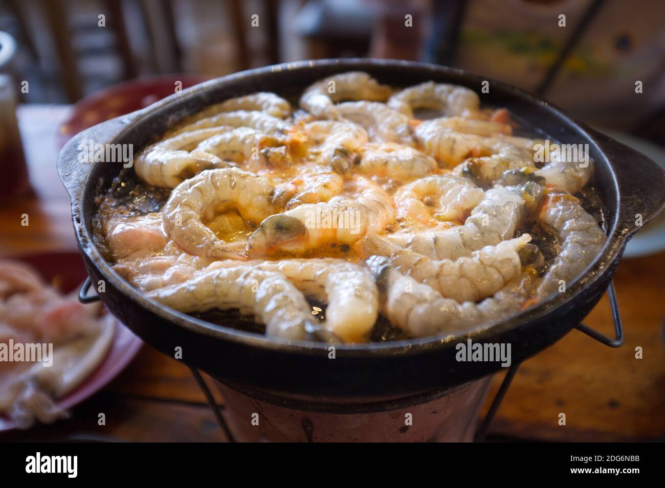Thai buffet with shrimp cooked on barbecue pan. Thai Barbecue or (Moo Kratha) Stock Photo