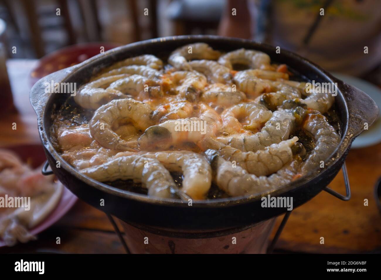 Thai buffet with shrimp cooked on barbecue pan. Thai Barbecue or (Moo Kratha) Stock Photo