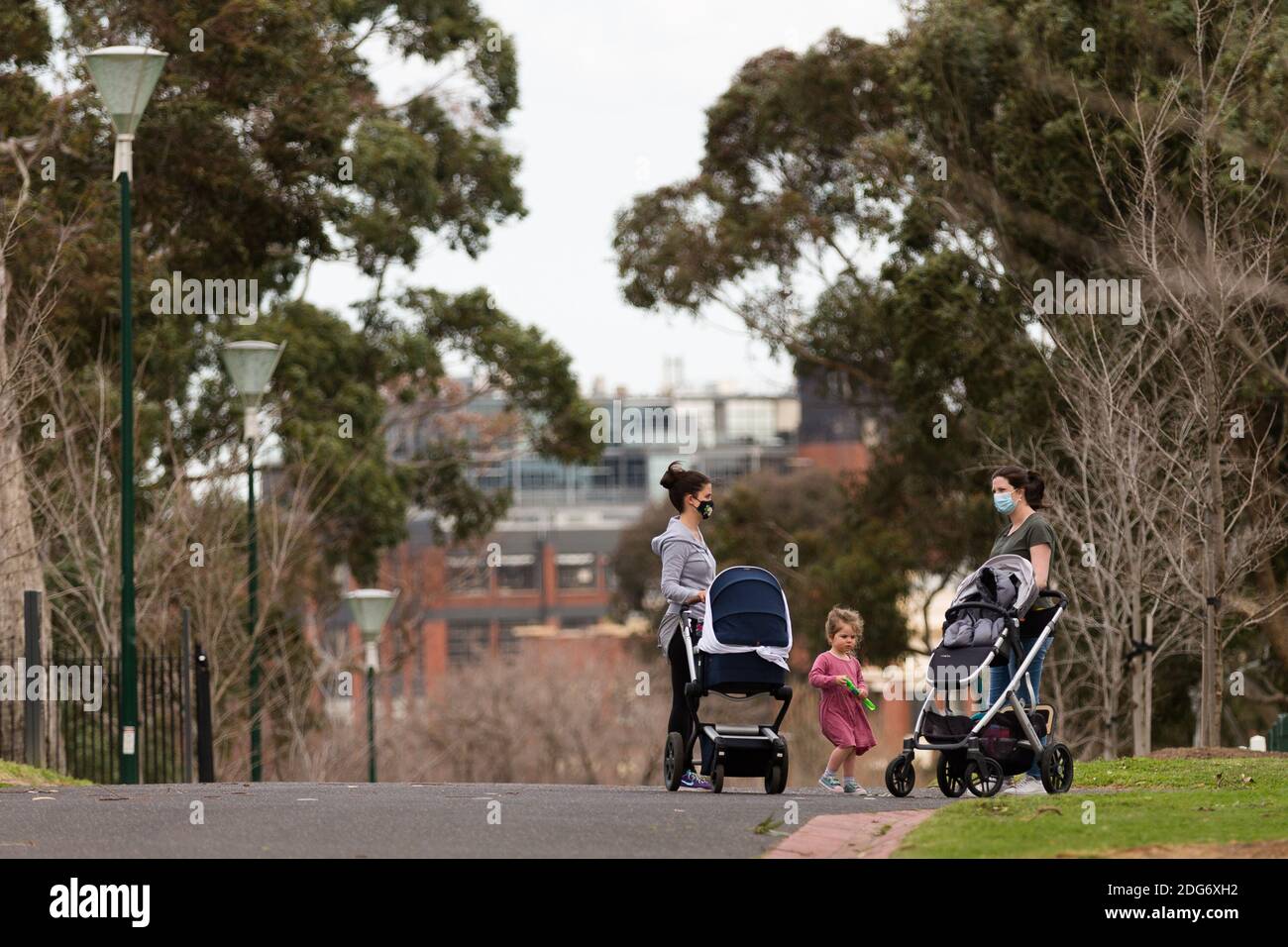 Melbourne, Australia, 2 September, 2020. Two mothers and their children are seen in conversation on the grounds of the MCG as an announcement was made today by the AFL CEO, Gillon McLachlan that the 2020 Grand Final will be held in Brisbane due to Daniel Andrews draconian rules in Victoria during COVID-19 in Melbourne, Australia.  Premier Daniel Andrews Labor Government was given a six month extension to their State of Emergency Powers. Under these powers, the government need not justify their response to the pandemic or have to face any scrutiny. It risks the continuation of major events in V Stock Photo