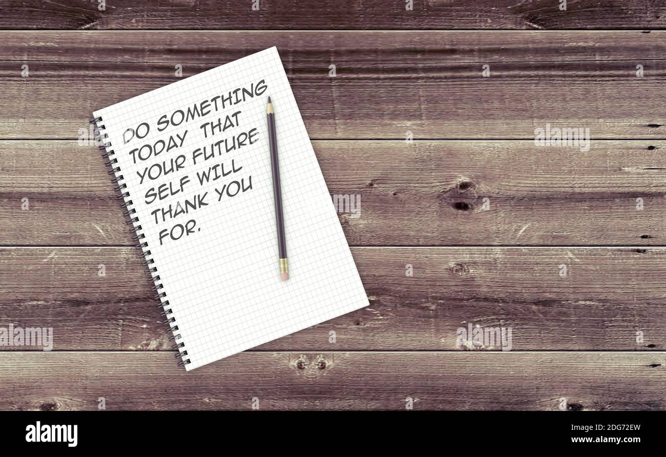Inspirational quote on notepad Stock Photo - Alamy