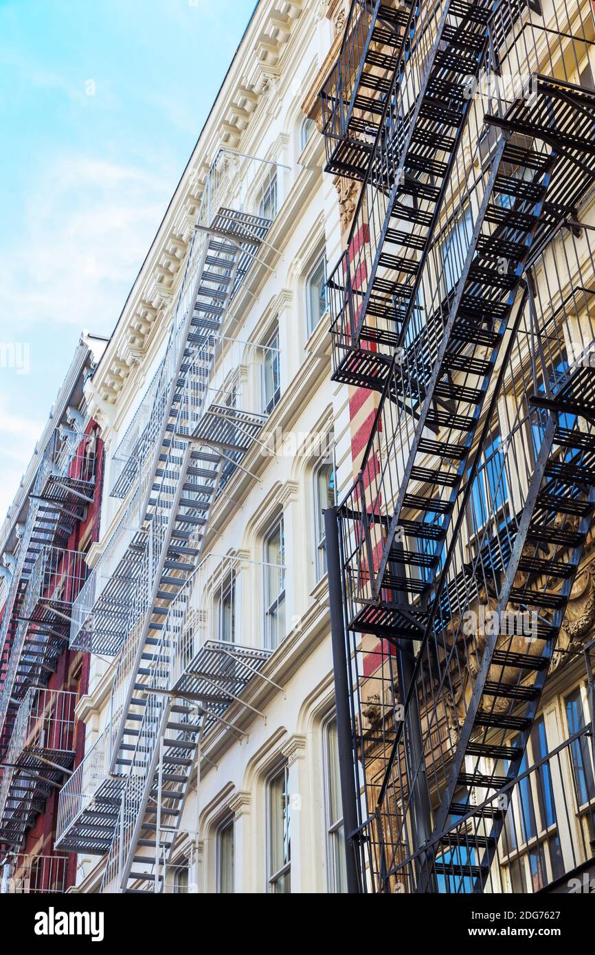 Old residential buildings with fire escape stairs in Soho, New York City Stock Photo