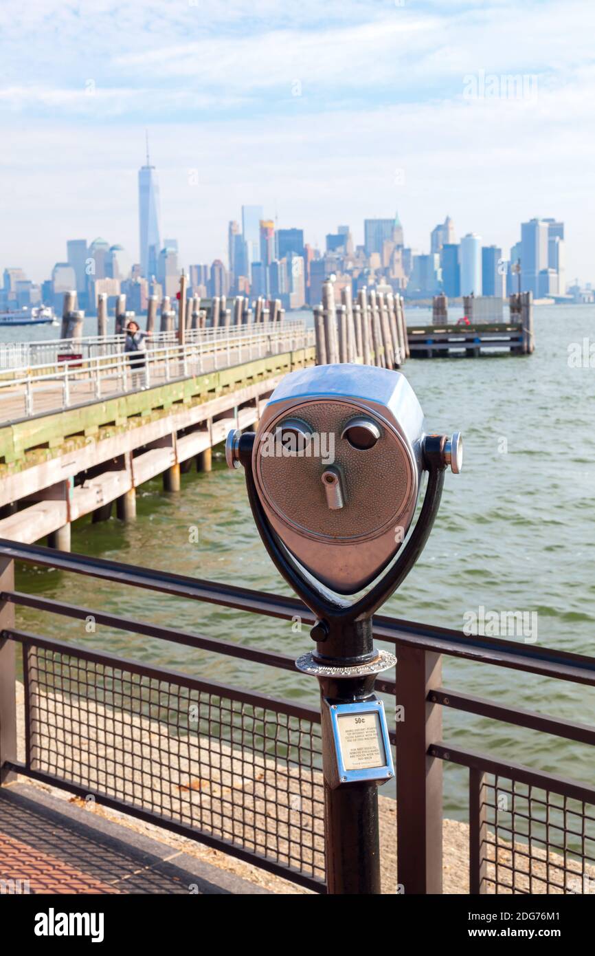 Antique binoculars on Liberty Island with view to Manhattan, New York City Stock Photo