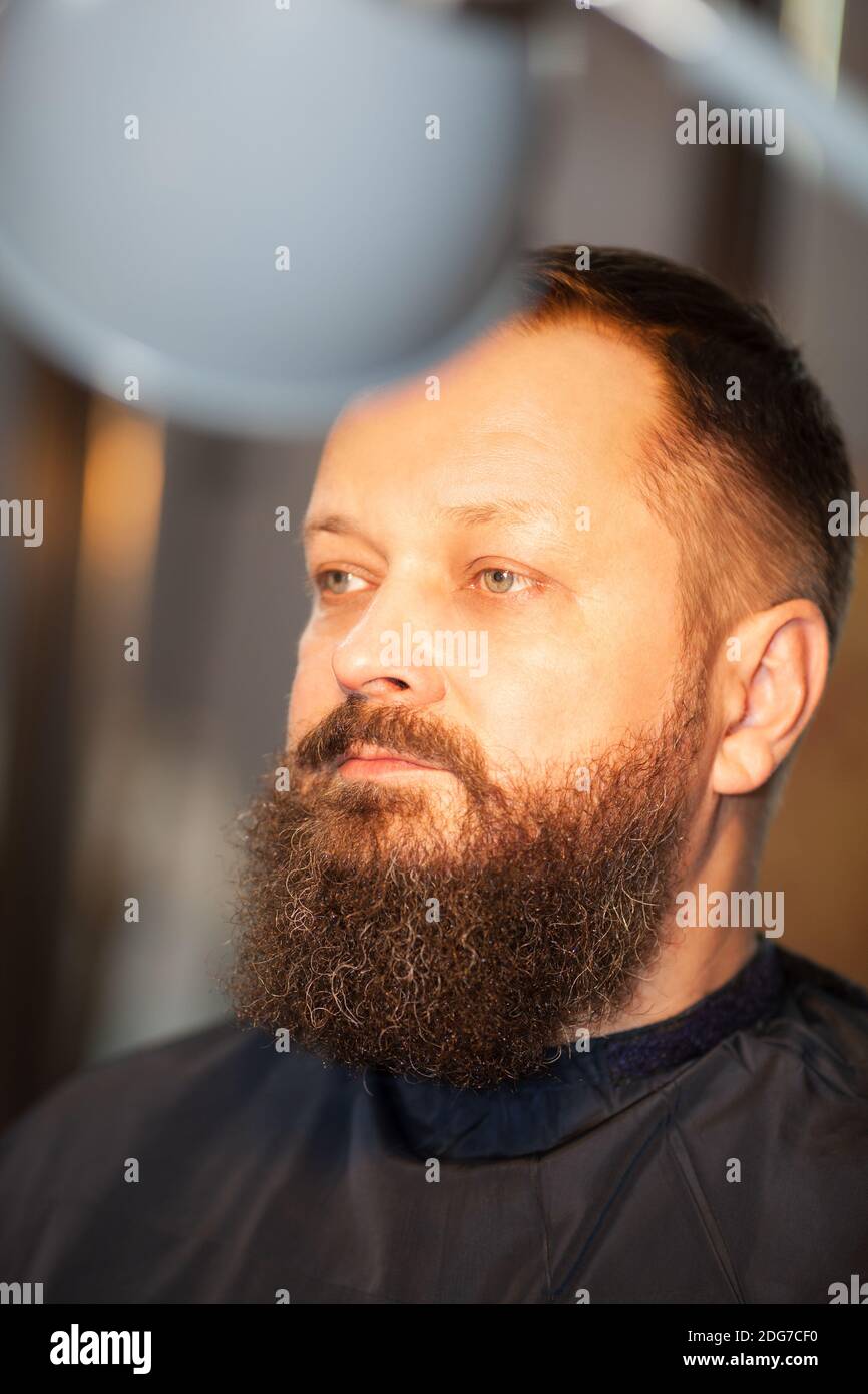 Attractive bearded man in a barber shop Stock Photo Alamy