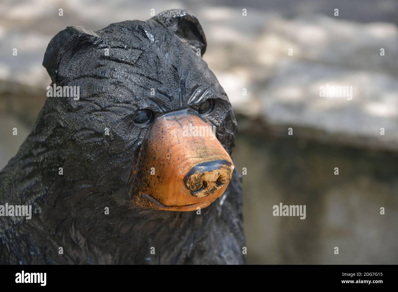 Public art. Black bear carved from tree trunks at Kentucky Down Under