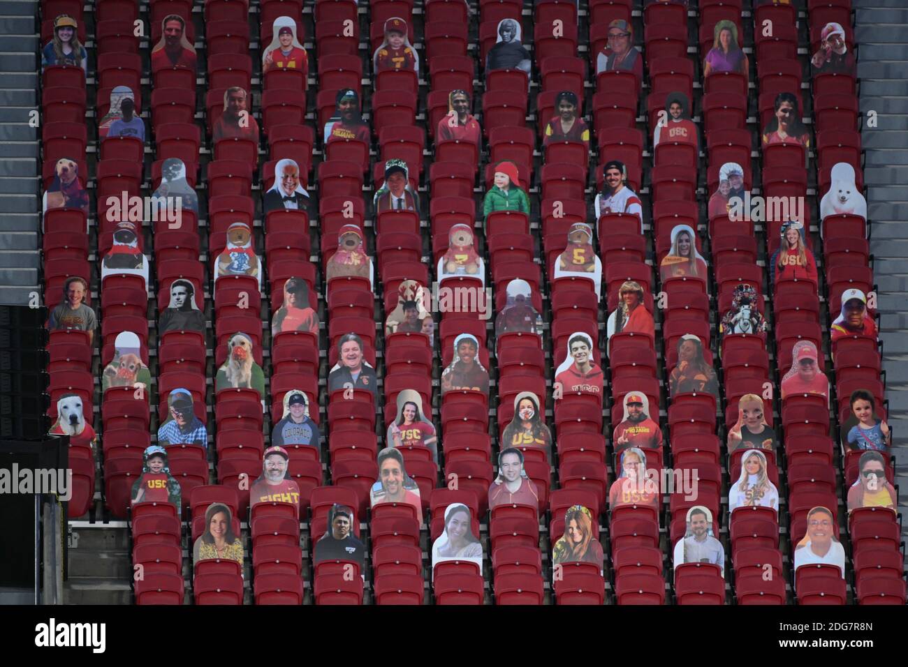 Cardboard cutouts of fans sit in the stands during an NCAA football