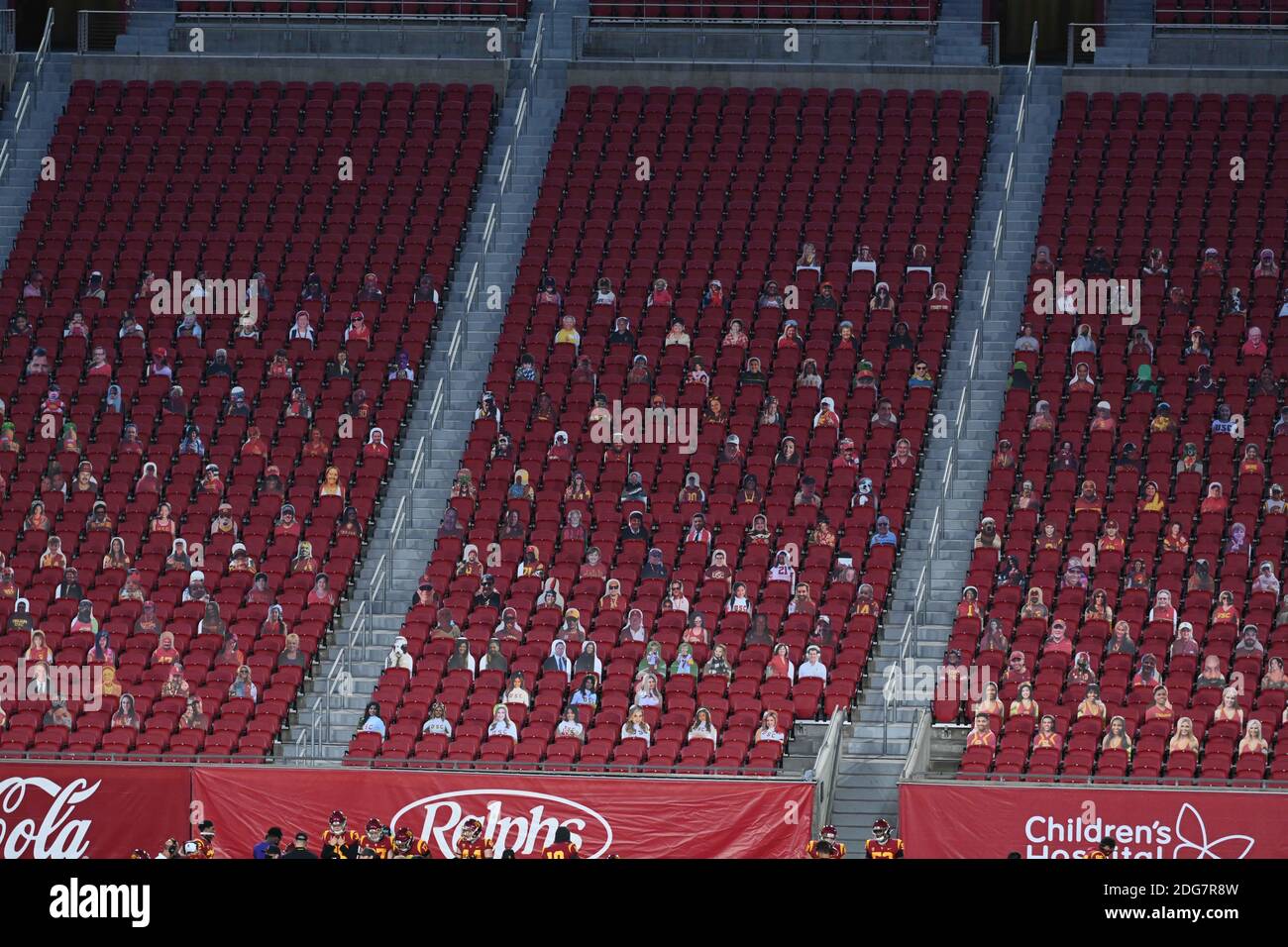 Cardboard cutouts of fans sit in the stands during an NCAA football game between the Southern California Trojans and the Washington State Cougars, Sun Stock Photo