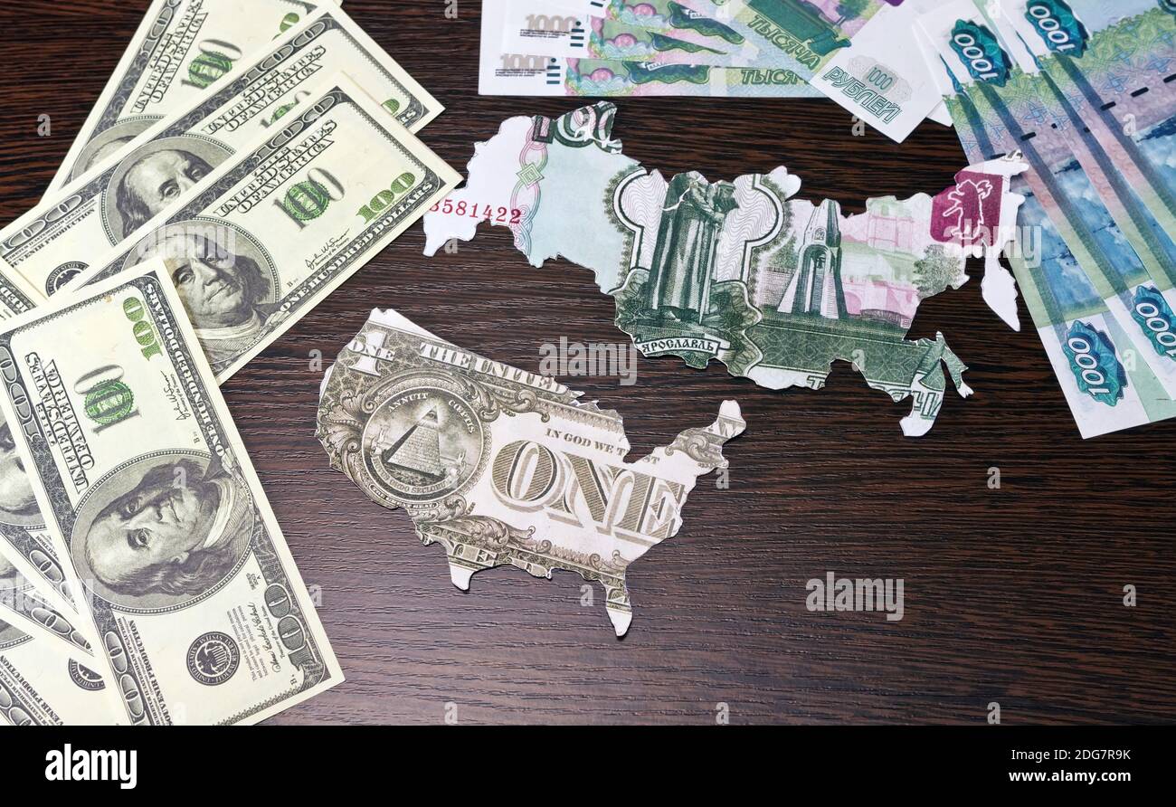 Contours of the U.S. and Russia carved out of dollars and rubles Stock Photo