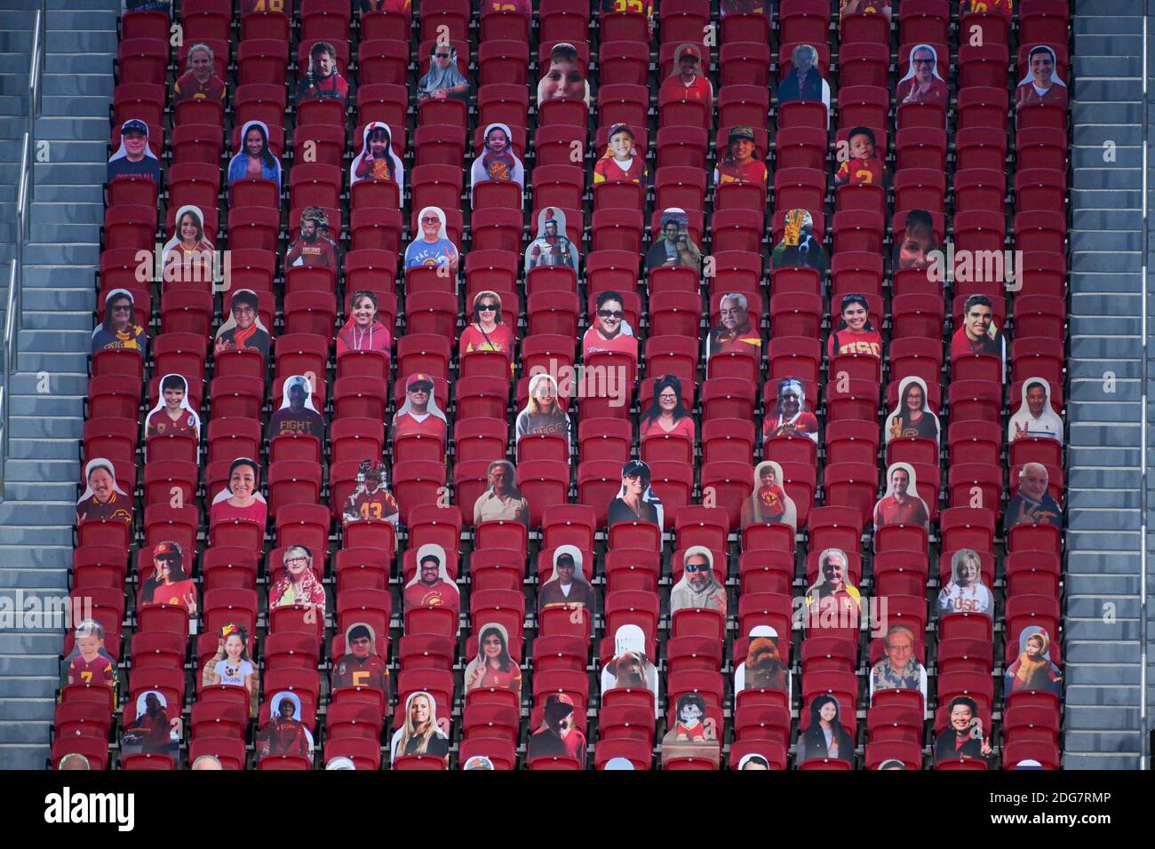 Cardboard cutouts of fans are seen in the stands of the Los Angeles Memorial Coliseum during an NCAA football game between the Southern California Tro Stock Photo