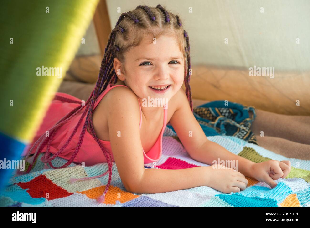 Happy smiling little girl with accessories in hair. Kids fashion