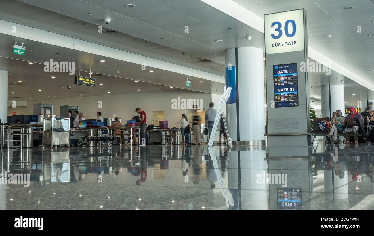 Airport hall with people in security checkpoint. Hanoi, Vietnam Stock Photo