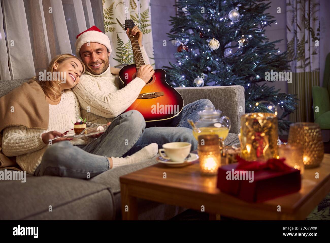 Handsome confident male in Santa hat 