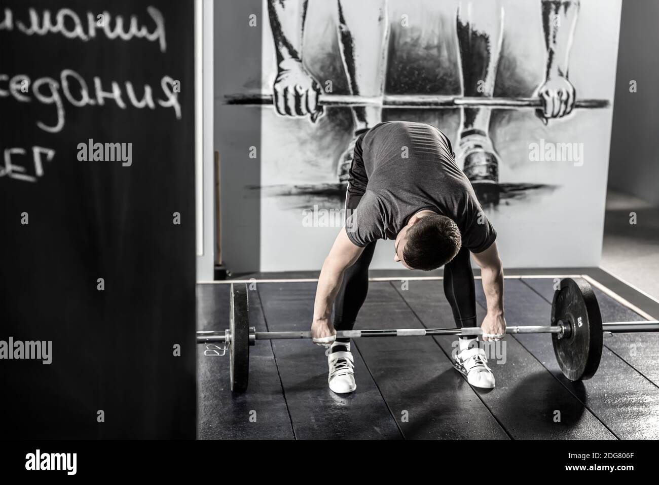 Workout with barbell in gym Stock Photo