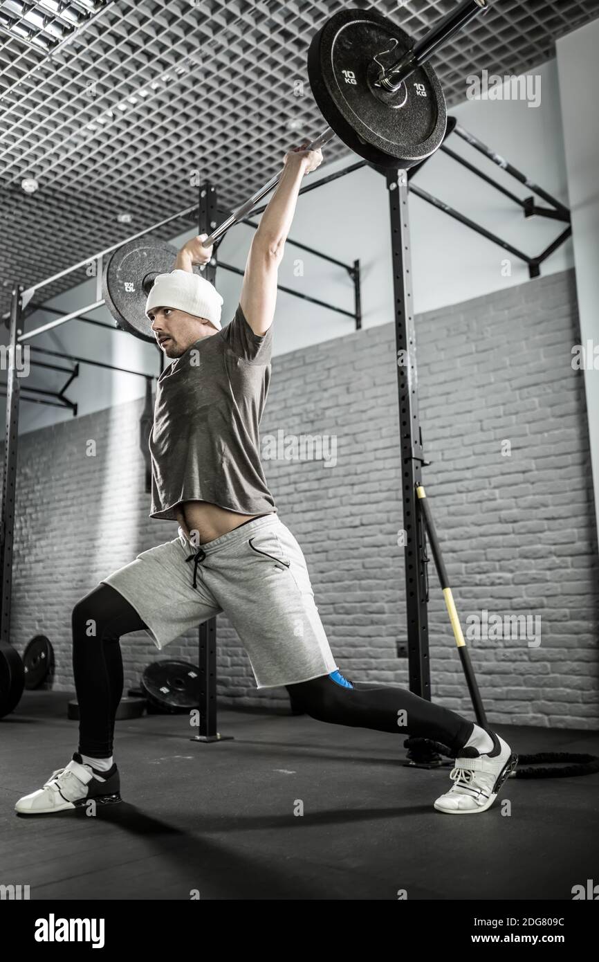 Man's crossfit workout with barbell Stock Photo Alamy