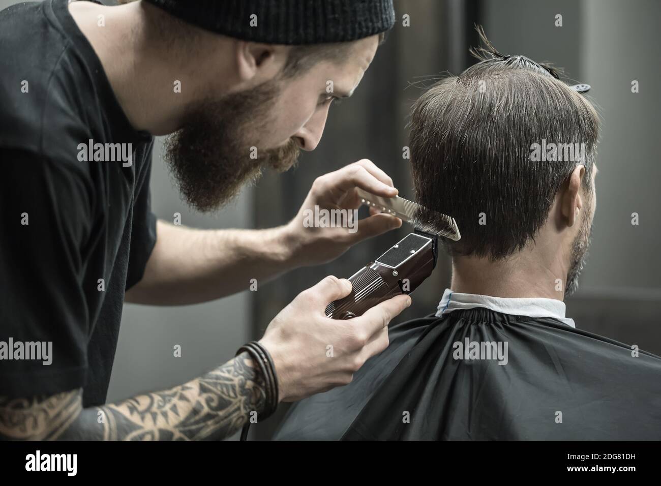Cutting hair in barbershop Stock Photo