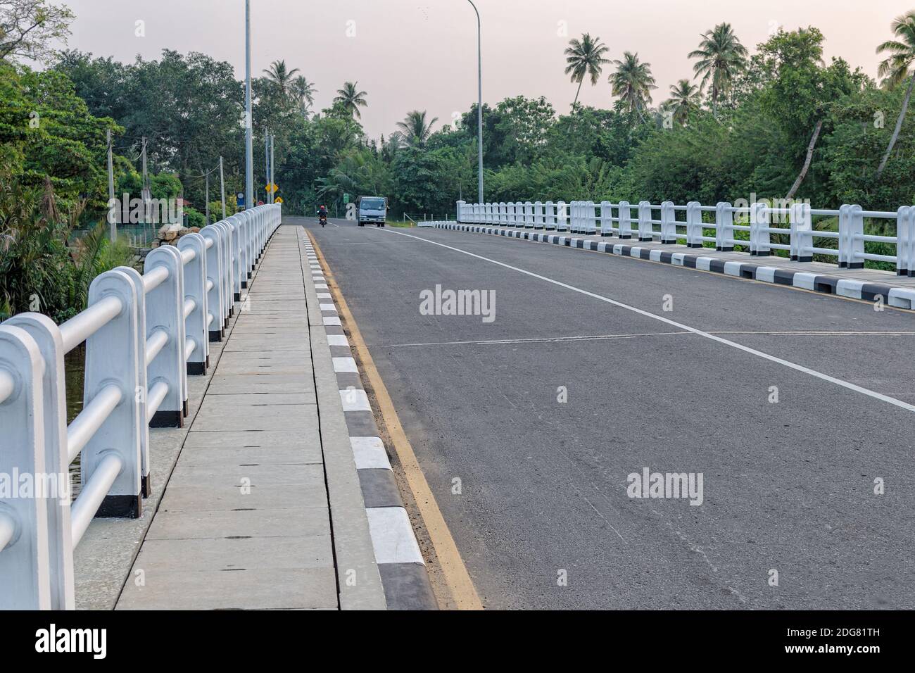 View of the asphalt bridge in the tropic country. Pedestrian walkway
