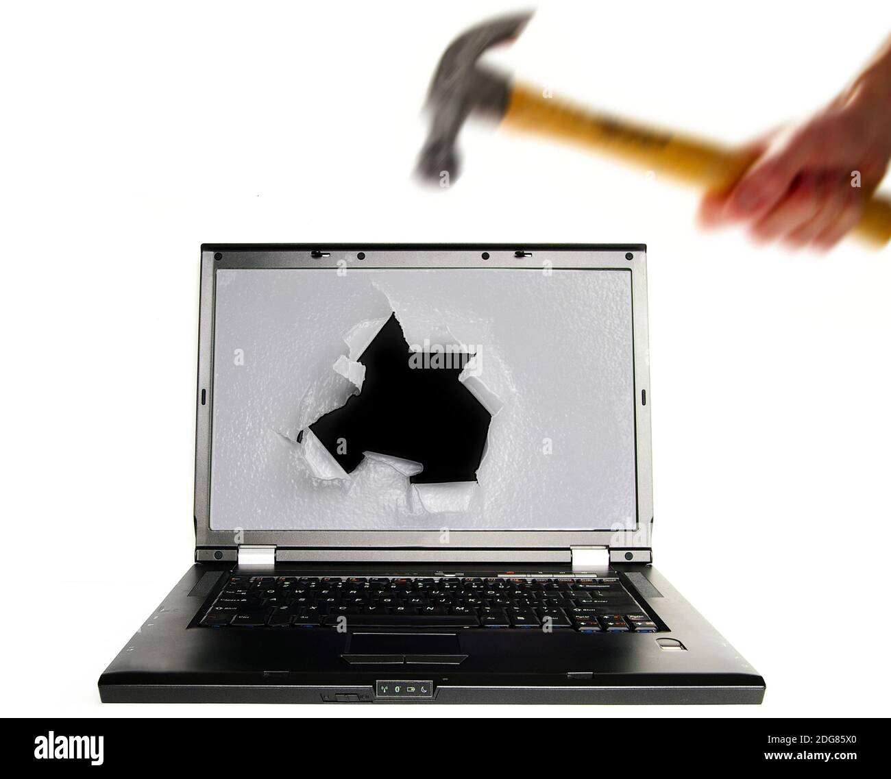 Hitting a PC with a hammer in frustration Stock Photo