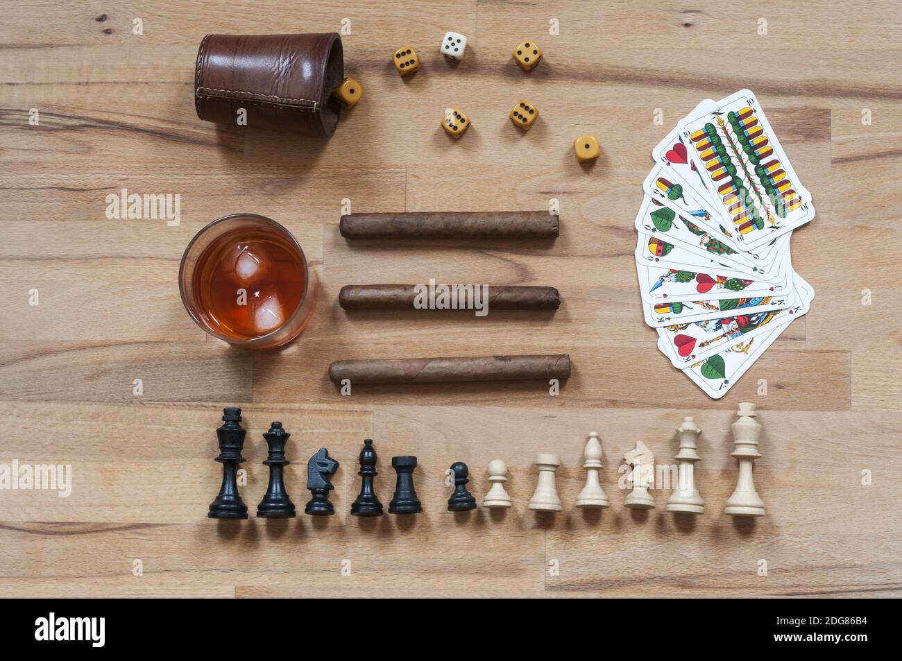 Dice game, chess piece, cards, cigars and alcoholic beverages Stock Photo