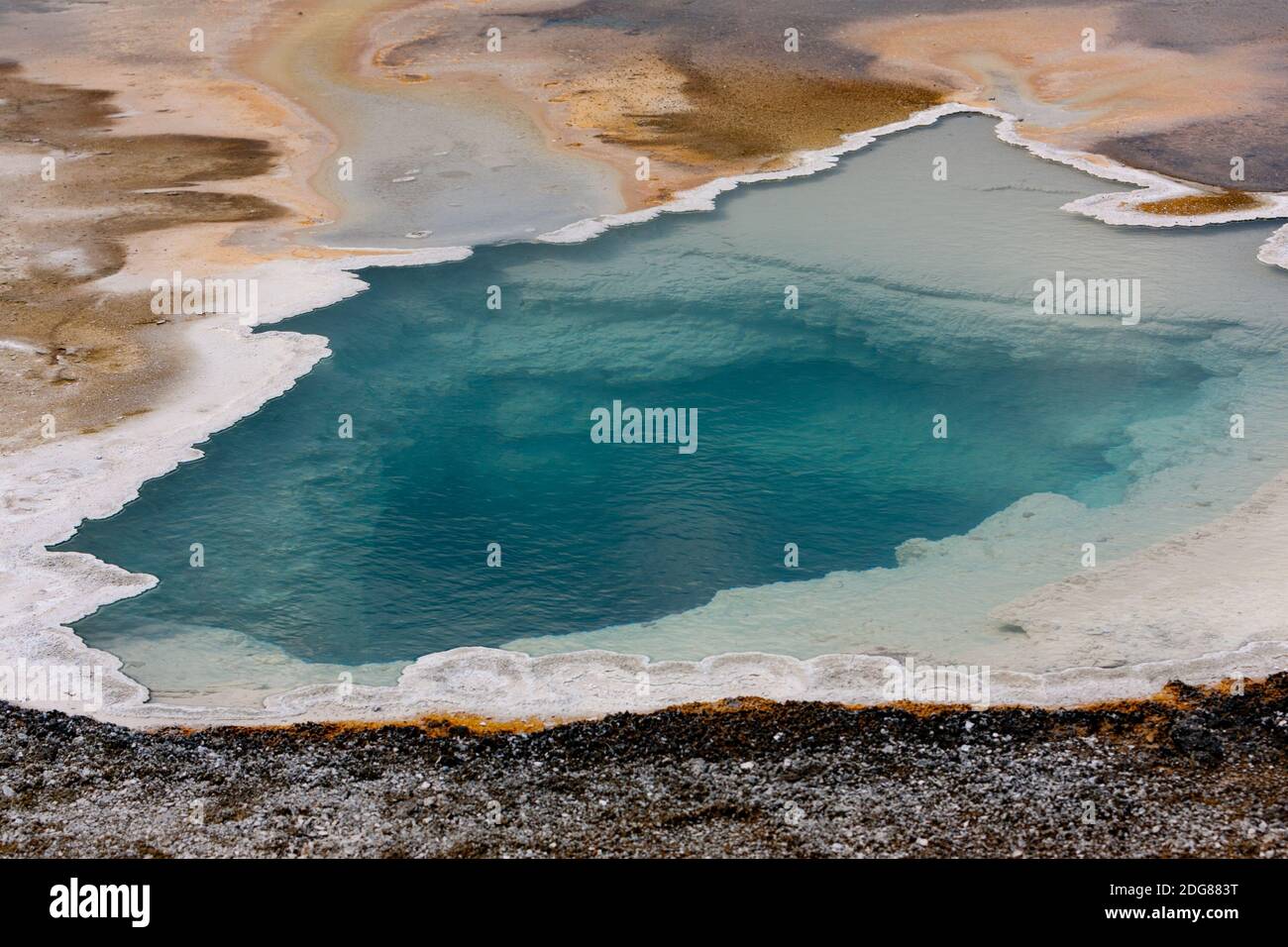 Colorful geothermal feature, Doublet Pool with scalloped geyserite deposits of opaline silica around the border, water about 190○f rare short eruption Stock Photo