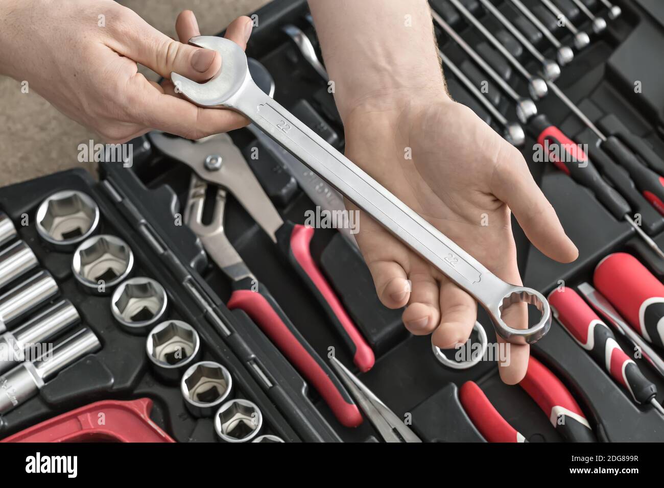 Open toolbox and male hands Stock Photo