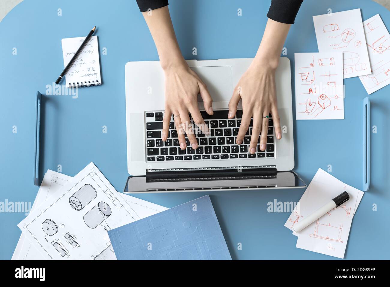 Girl using laptop in office Stock Photo
