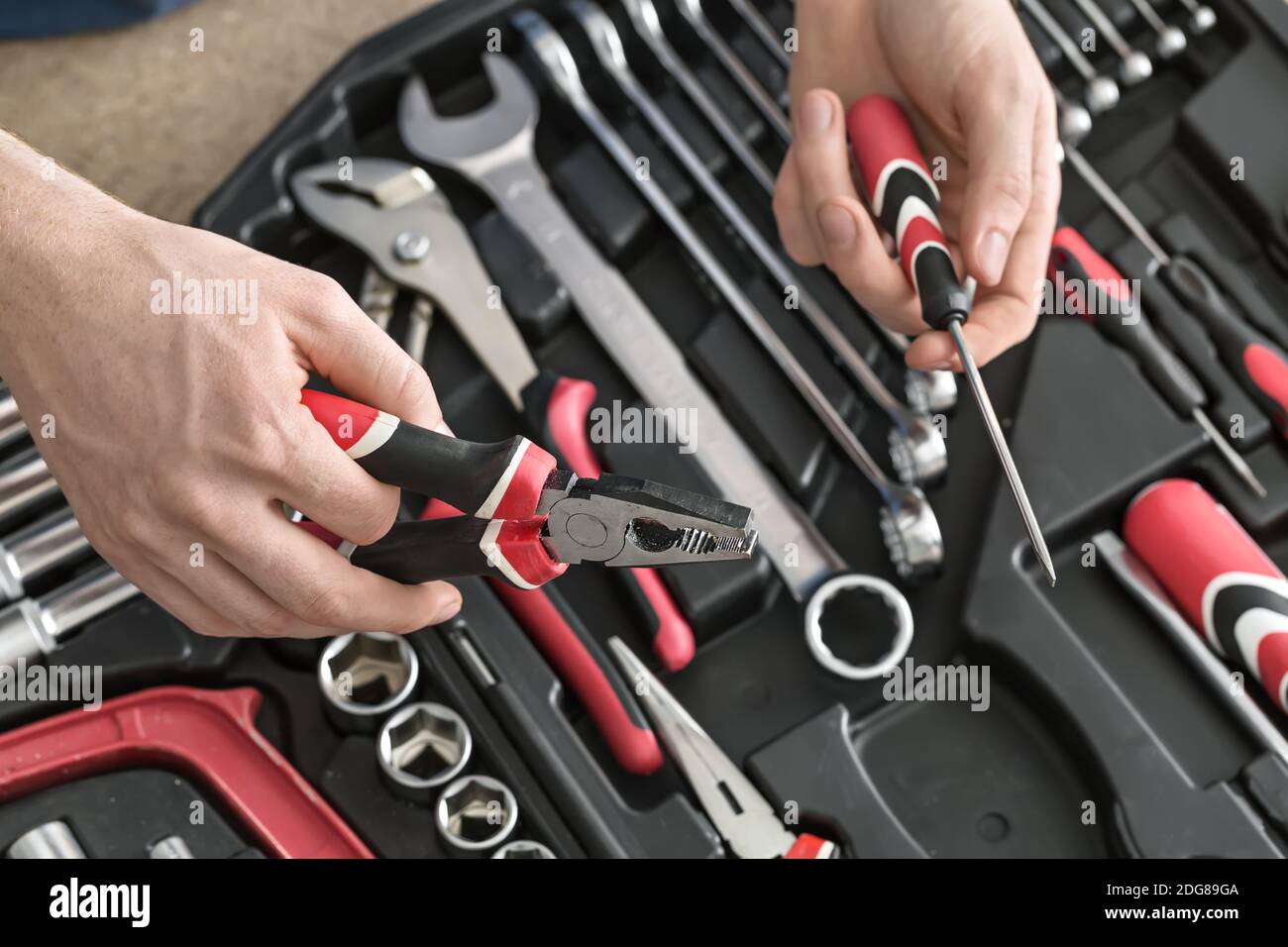 Open toolbox and male hands Stock Photo