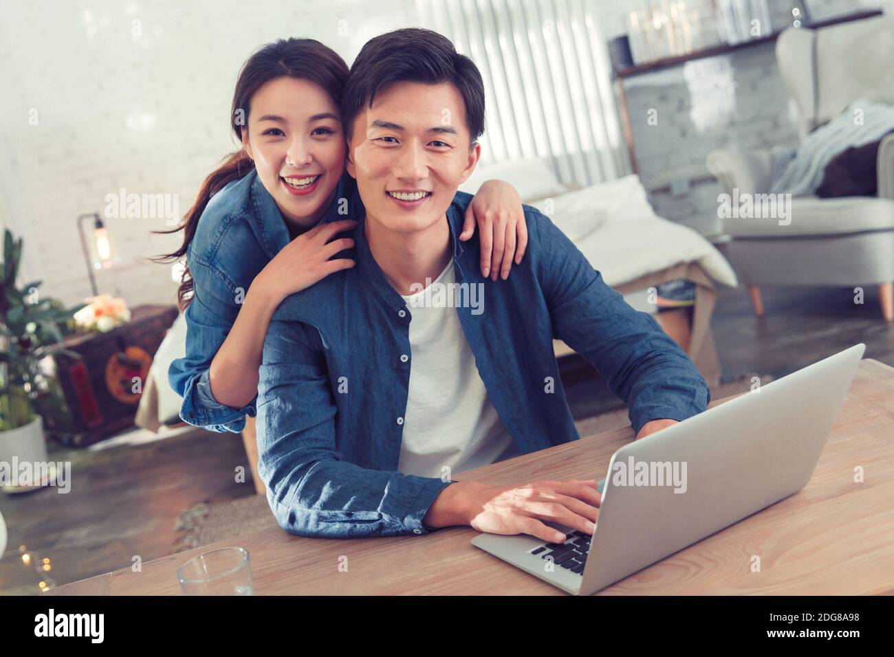 Happy young couples home office Stock Photo