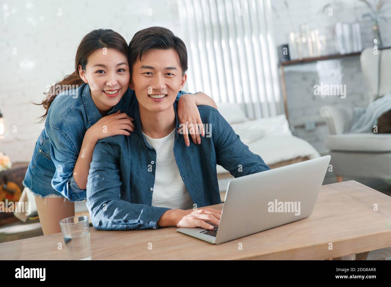 Happy young couples home office Stock Photo