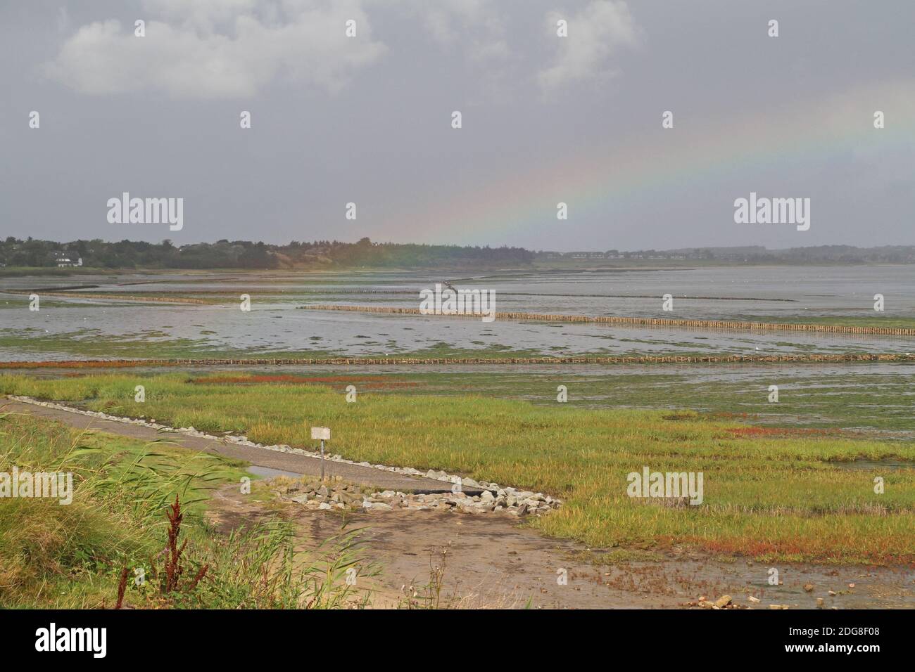 Rainbow over the mudflat, Keitum, Germany Stock Photo