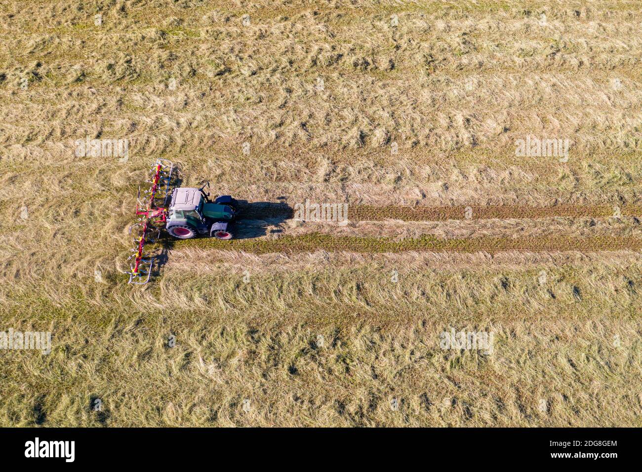 Top view of tractor with tedders, drying mowed hay Stock Photo Alamy