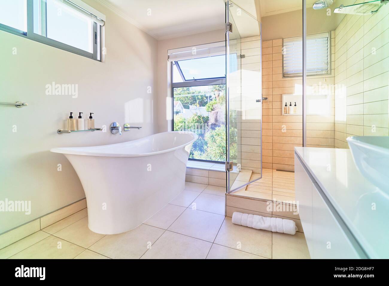 Modern home showcase interior bathroom with white soaking tub Stock Photo