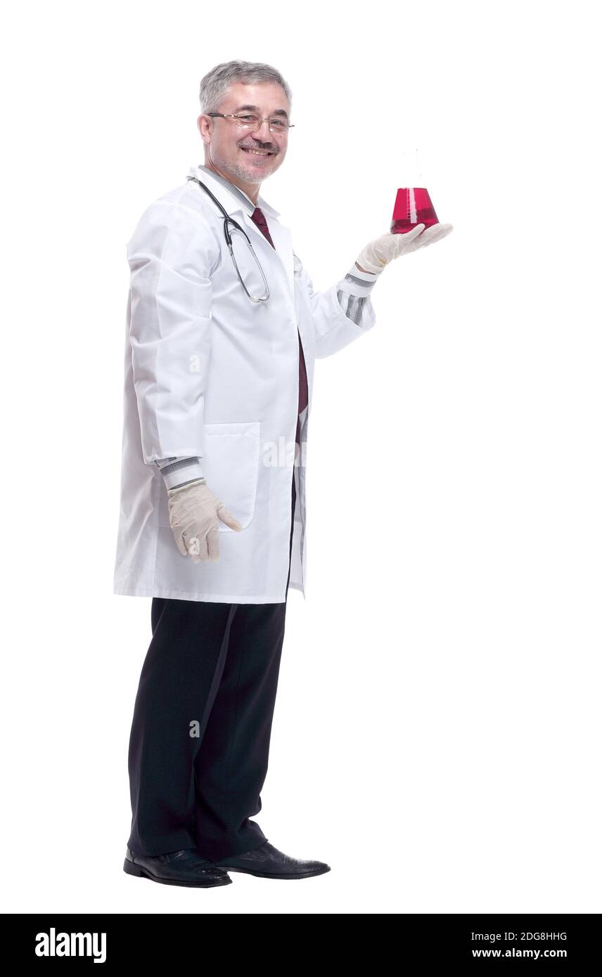smiling doctor looking at the liquid in the flask Stock Photo