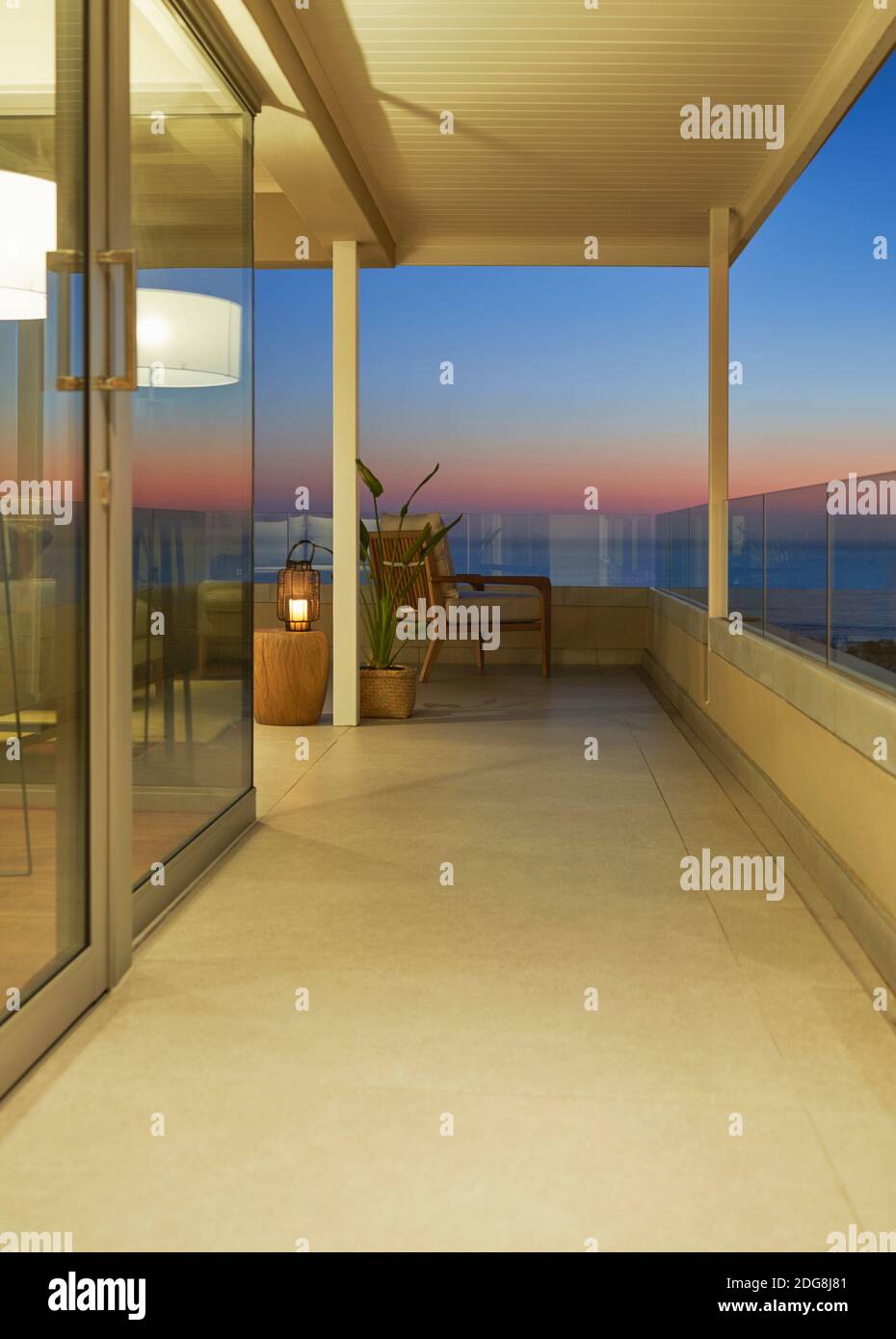 Luxury balcony with scenic ocean view at dusk Stock Photo