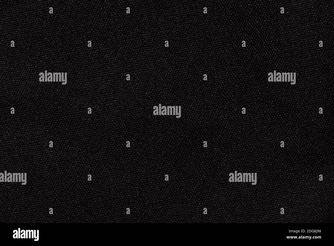 Structure of black fabric as pattern backdrop. Dark grey background from textile material with wicker texture. Stock Photo