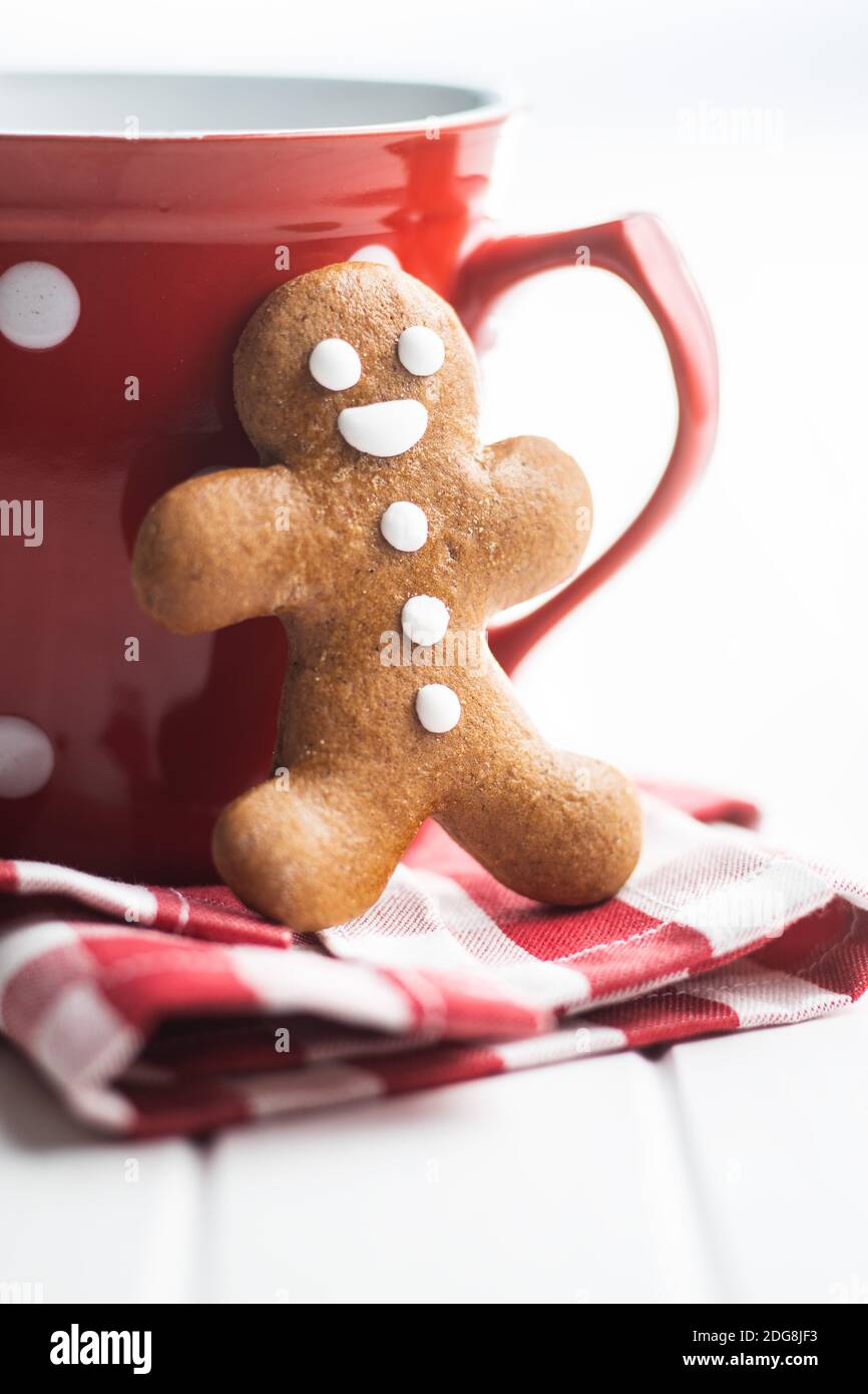 Xmas gingerbread man on checkered napkin. Stock Photo