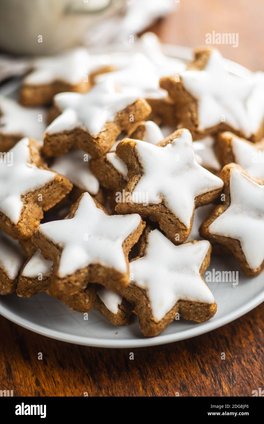 Icing gingerbread stars. Traditional Christmas cookies on plate Stock ...