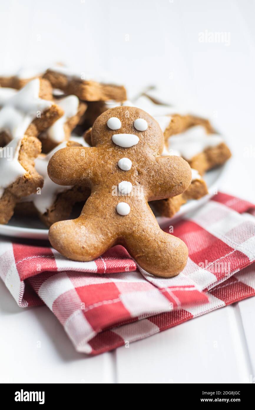 Xmas gingerbread man on checkered napkin. Stock Photo