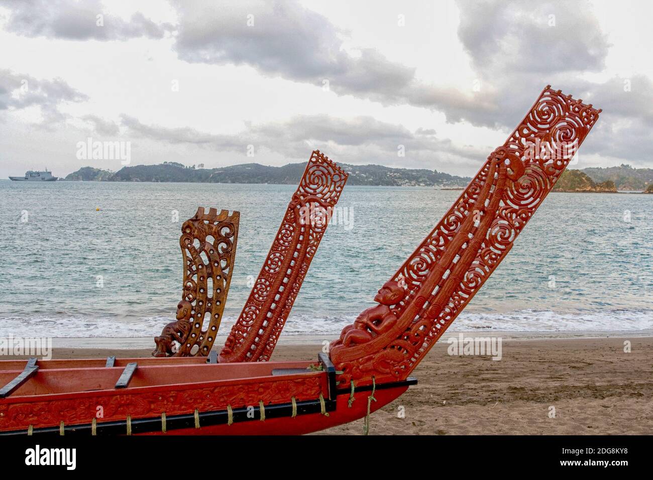 Three beautiful wooden carved Maori war canoes on beach in Waitangi Stock Photo